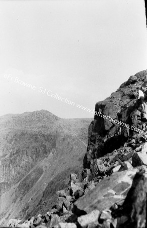 IN LAKELAND SCAFELL PIKE,DESCENDING : DR BERTIA MARTIN J BIRKENHEAD JUST BELOW SUMMIT